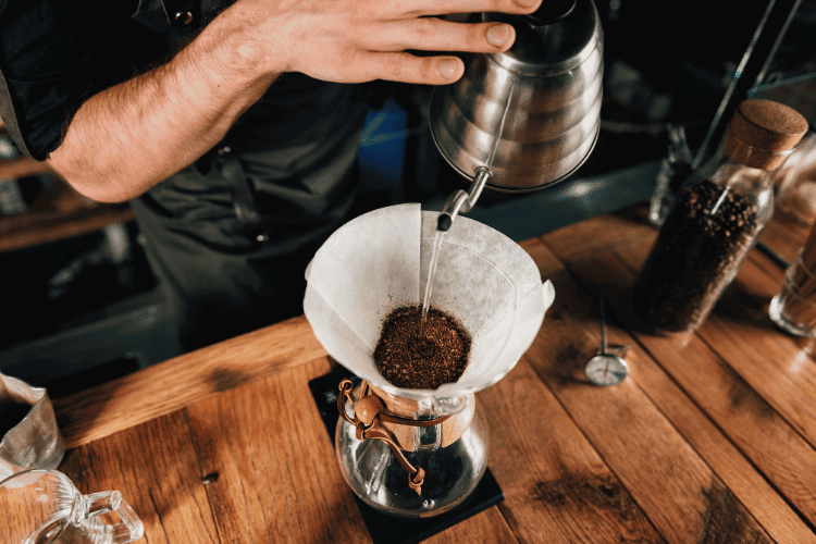 Top view of a barista making drip filter coffee