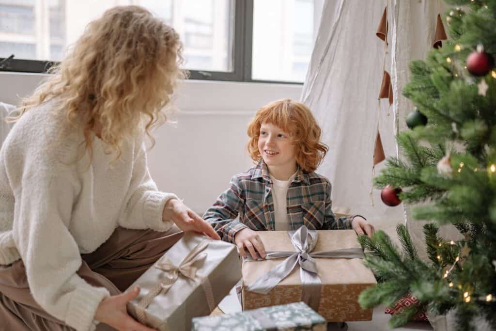 mom and child with christmas gifts