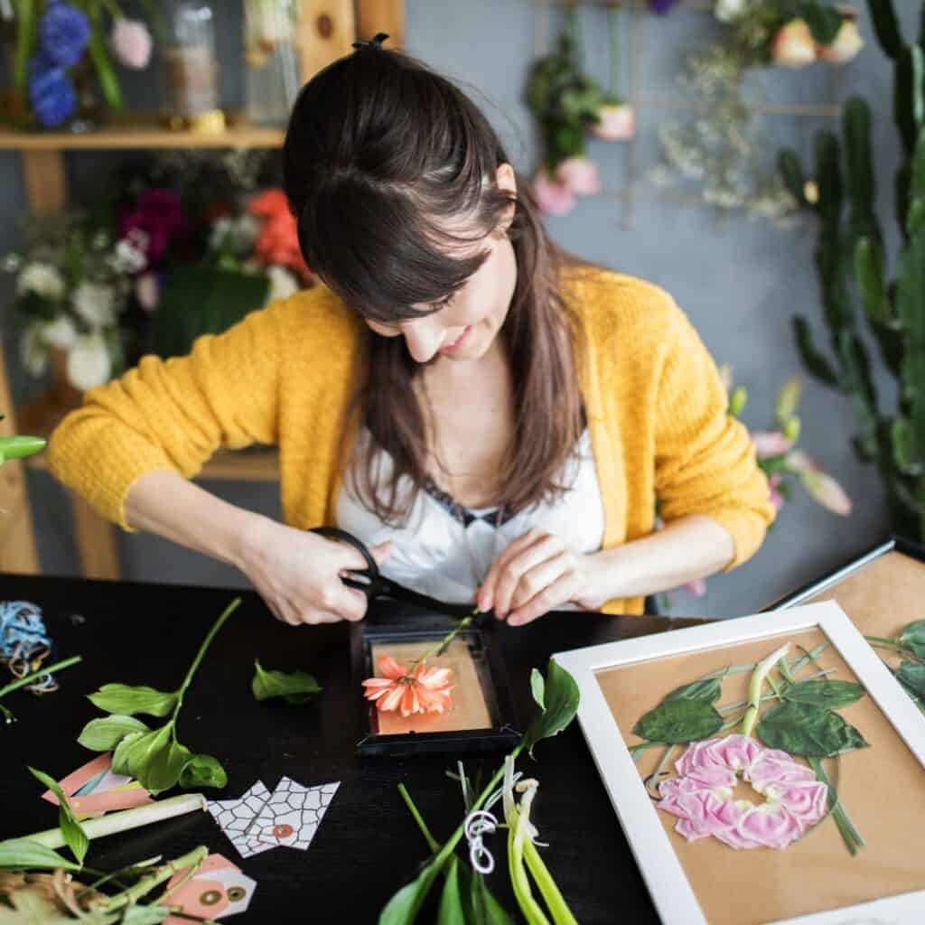 Woman pressing flowers