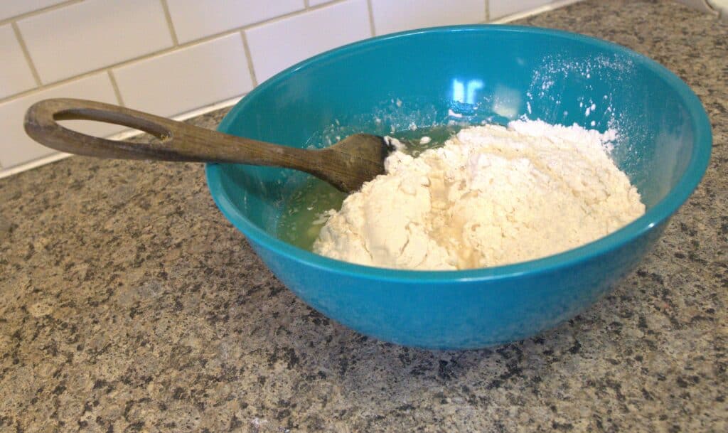 mixing pizza dough