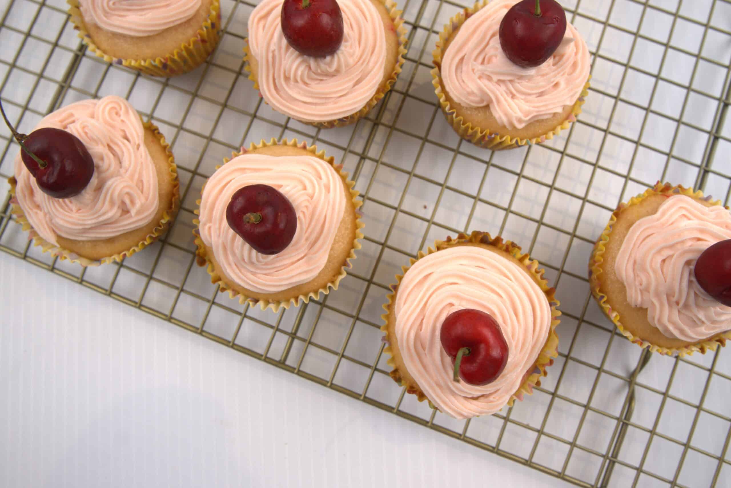 Cherry icing cupcakes